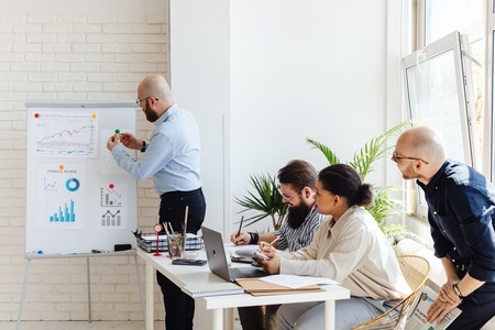 Employees working in modern NYC office who have pivoted in their career