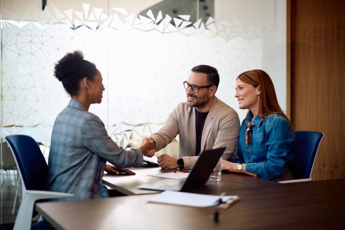 Accountant who uses AI discussing taxes with clients